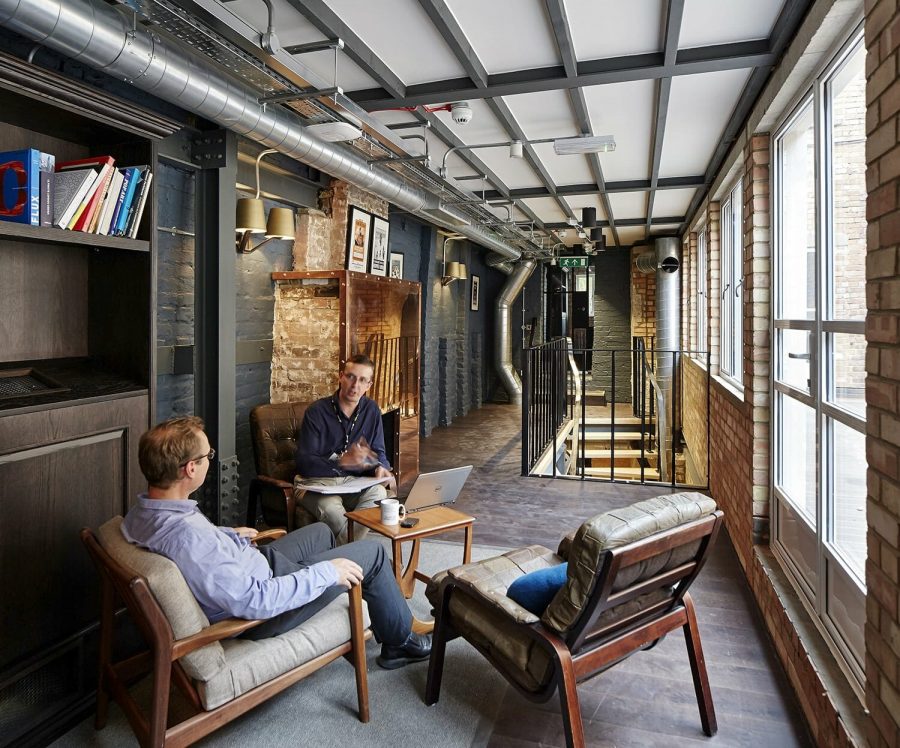 Two men working together in modern working space